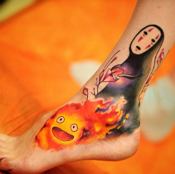 Tattoo featuring Studio Ghibli characters on foot, inspired by Miyazaki films.