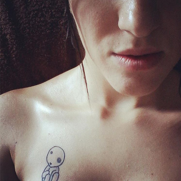 Tattoo of a Kodama spirit on a collarbone, inspired by Studio Ghibli and Miyazaki films.