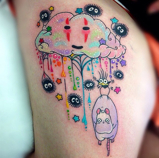 Studio Ghibli tattoo with colorful cloud and soot sprites inspired by Miyazaki films.