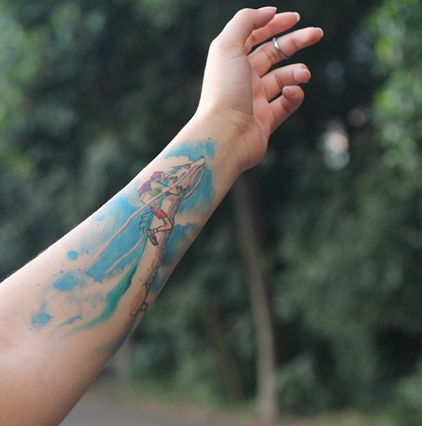 Studio Ghibli tattoo on forearm featuring a character riding a white dragon, inspired by Miyazaki films.
