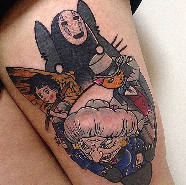 Studio Ghibli tattoo featuring characters from Miyazaki films on a person's arm.