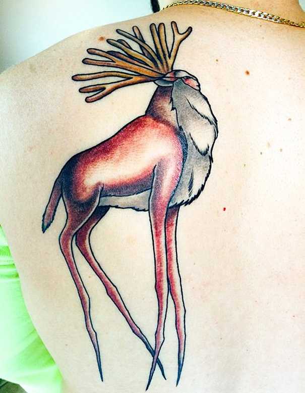 Studio Ghibli tattoo from Princess Mononoke of a mystical deer with antlers on a person's back.