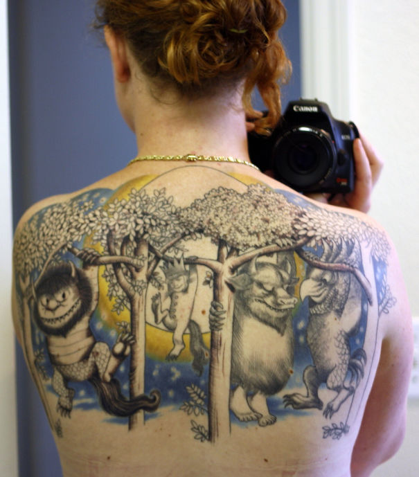 Back tattoo with "Where the Wild Things Are" scene, perfect for bookworms.