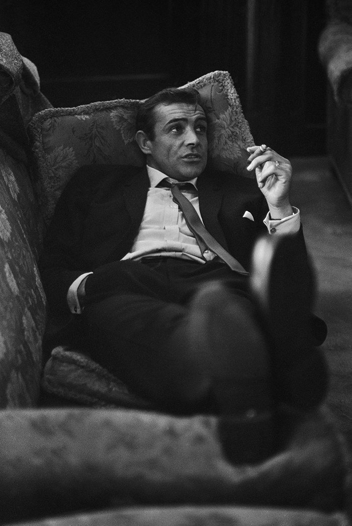 A Young Sean Connery Smoking A Cigar
