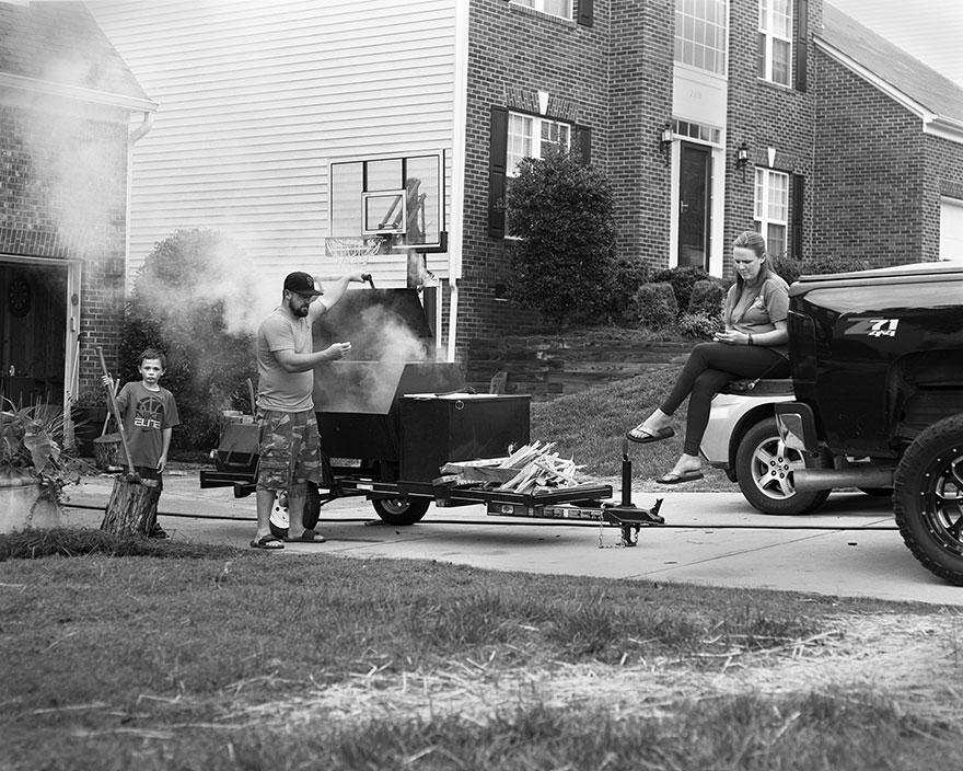 Black and white portrait of family interacting outdoors with phones digitally removed, highlighting phone addiction in modern life. Black and white portrait of family interacting outdoors with phones digitally removed, highlighting phone addiction in modern life.