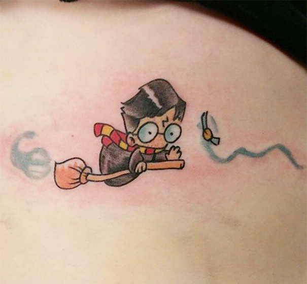 Book-inspired tattoo of a young wizard on a broomstick chasing a winged ball.