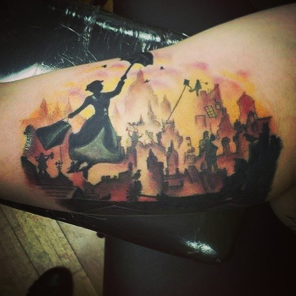 Book-inspired tattoo of a silhouetted figure flying over a cityscape with a parasol, set against a sunset backdrop.