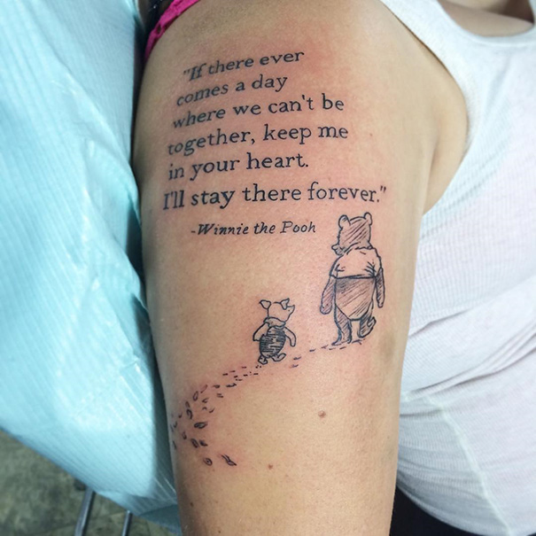 Winnie the Pooh tattoo with quote on arm, perfect for bookworms.