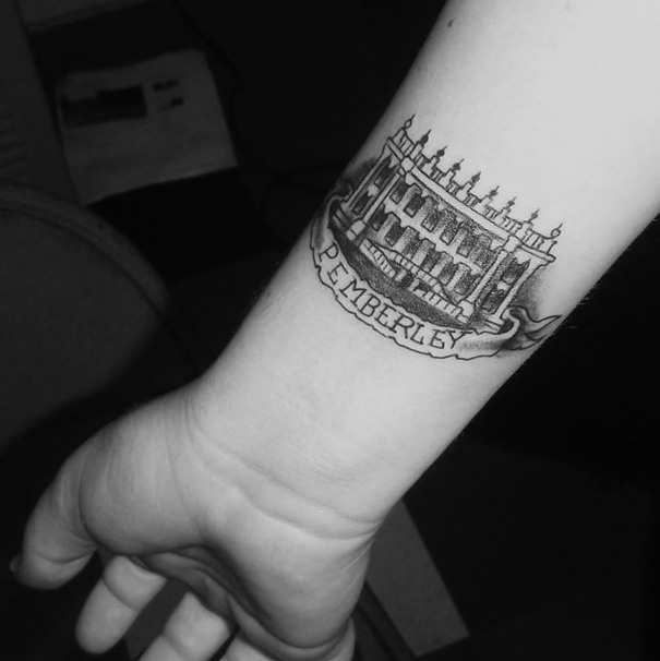 Tattoo of the Pemberley estate on a forearm, a design inspired by classic literature for bookworms.