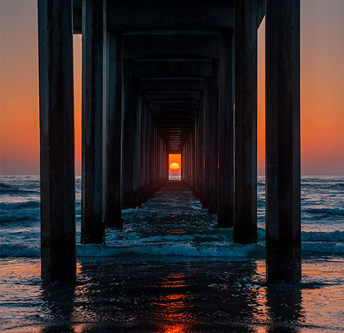 Twice A Year, The Sunset Aligns Perfectly With This Pier In California