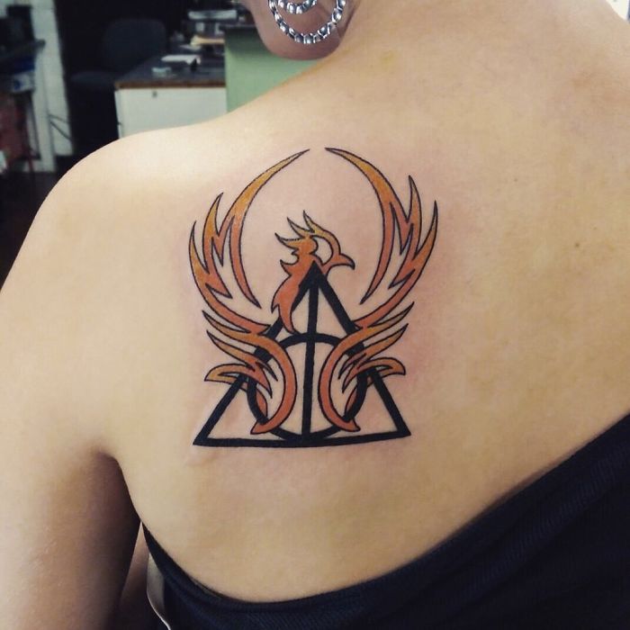 Phoenix and Deathly Hallows Harry Potter tattoo on shoulder.