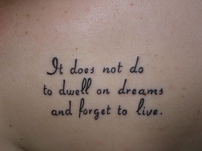 Harry Potter tattoo with the quote "It does not do to dwell on dreams and forget to live."
