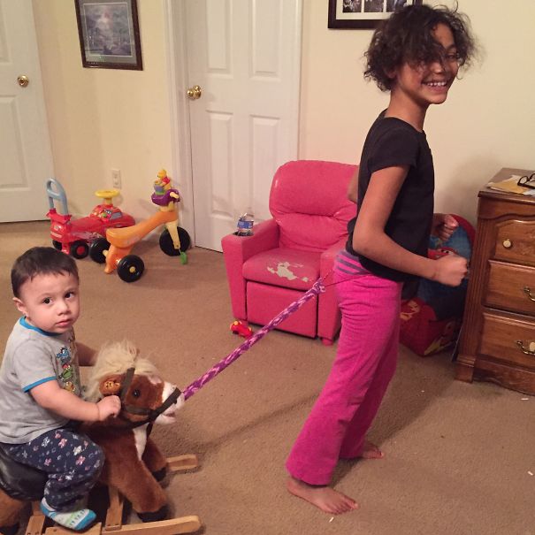 My 9 Yr Old Daughter Tirelessly Pulling Her Little Brother Around On His Horsey.