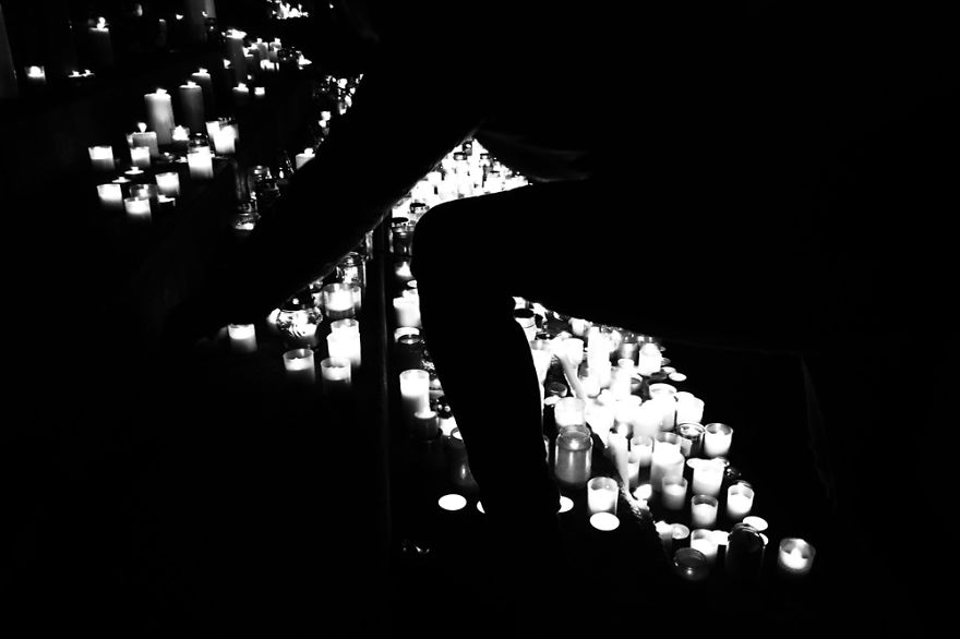 Young Hungarian Girl Light Candle For The Victims In Paris. Budapest, St. Stephen's Basilica