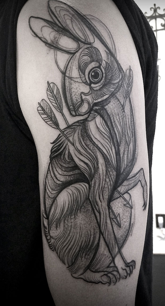 Sketch tattoo resembling a pencil drawing of a rabbit, featuring intricate lines and shading by Nomi Chi.