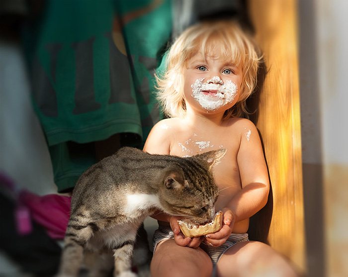 Kid With A Cat