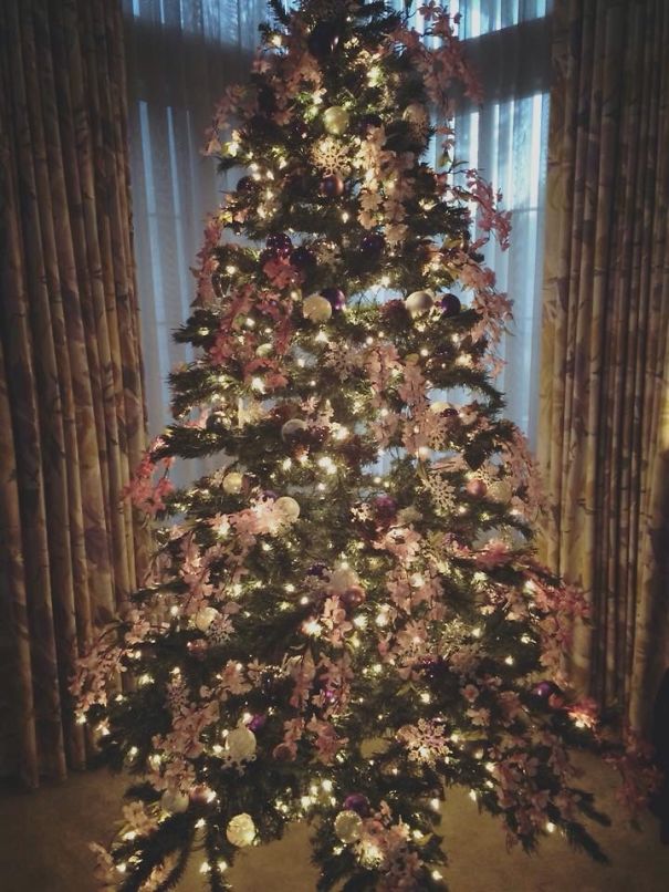 Pink Silk Cherry Blossoms; Silver, Pink And Purple Balls; And Opalescent Snow Flakes.