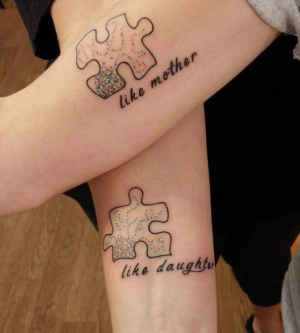 Mother-daughter tattoos of puzzle pieces with "like mother" and "like daughter" text, symbolizing their bond.