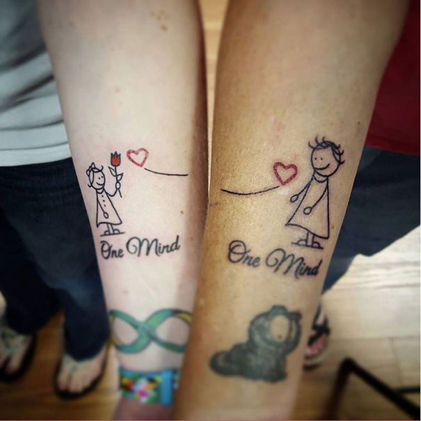 Mother-daughter tattoos with stick figures, hearts, and the text "One Mind," symbolizing their unbreakable bond.