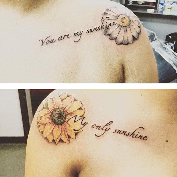 Mother-daughter tattoos with daisies and text: "You are my sunshine," "My only sunshine," symbolizing their bond.