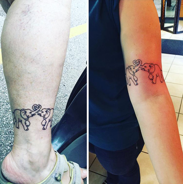 Mother-daughter elephant tattoos on arms, symbolizing their unbreakable bond.