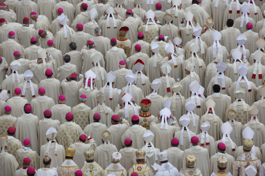 A group of robed figures with pink hats; a "Find The Panda" puzzle challenge.