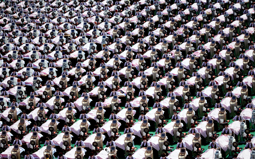"Find the Panda puzzle with many people wearing identical black and white outfits in neat rows."