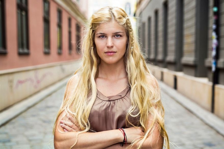 Romanian photographer captures a woman in an urban setting, showcasing beauty from diverse cultures worldwide.