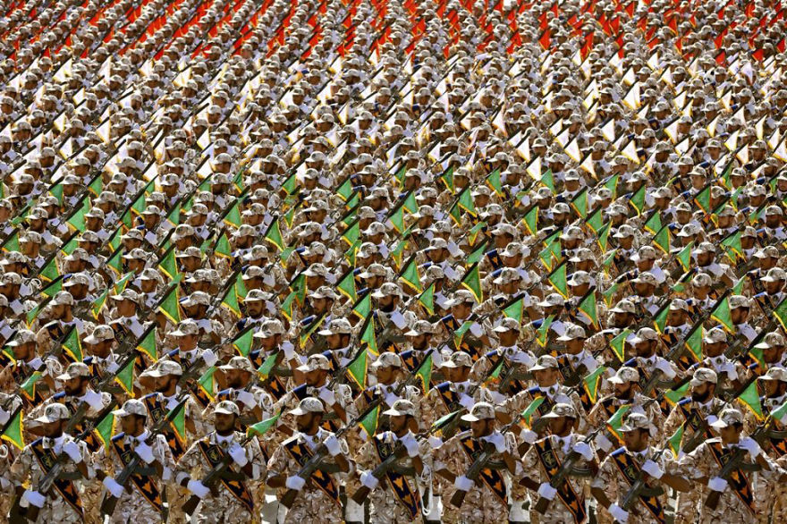Military parade formation with soldiers; a visual puzzle to find the panda.