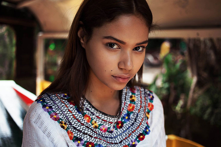 Woman from 121 countries project, wearing a colorful embroidered top, photographed by a Romanian photographer.