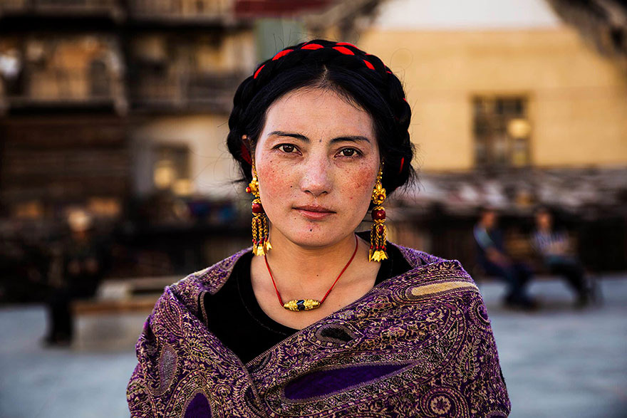 Portrait by Romanian photographer showcasing global beauty, featuring a woman in traditional attire from one of 121 countries.