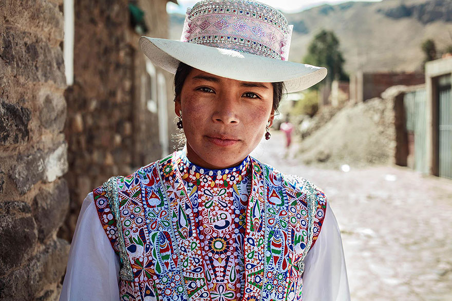Romanian photographer captures a woman in traditional, colorful attire, showcasing global beauty.