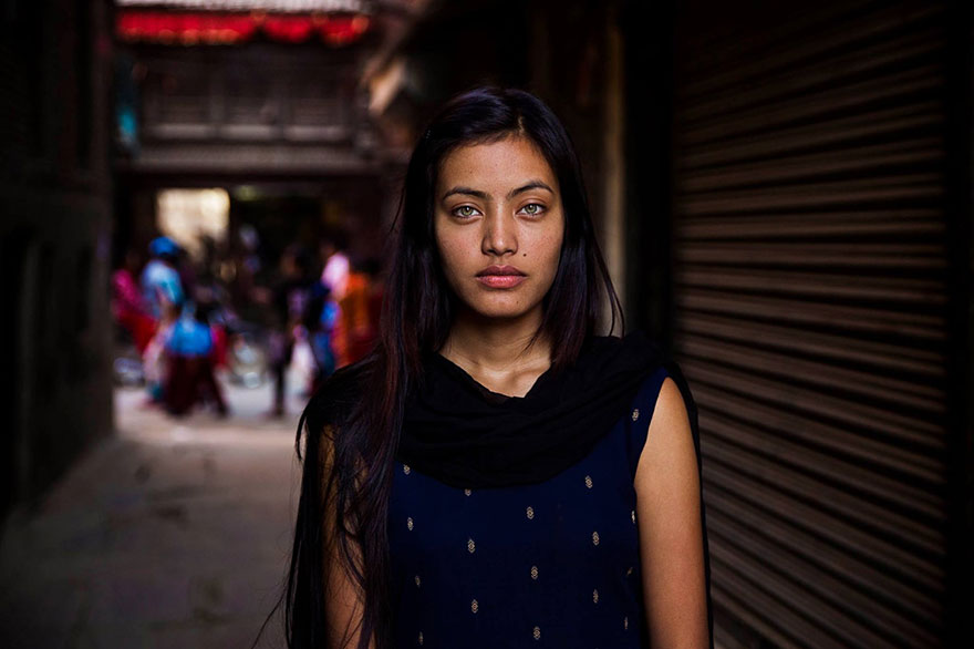 Woman photographed in urban setting by Romanian photographer, showcasing diverse beauty.