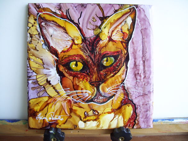 Abstract cat painting with vibrant colors, ready for Valentine's Day celebration, featuring bright green eyes and pink background.