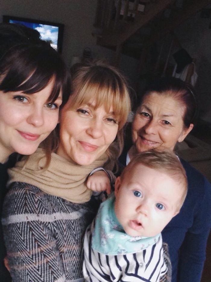 Three generations of women and a baby showing strong family resemblance as kids are copy-paste versions of their parents.