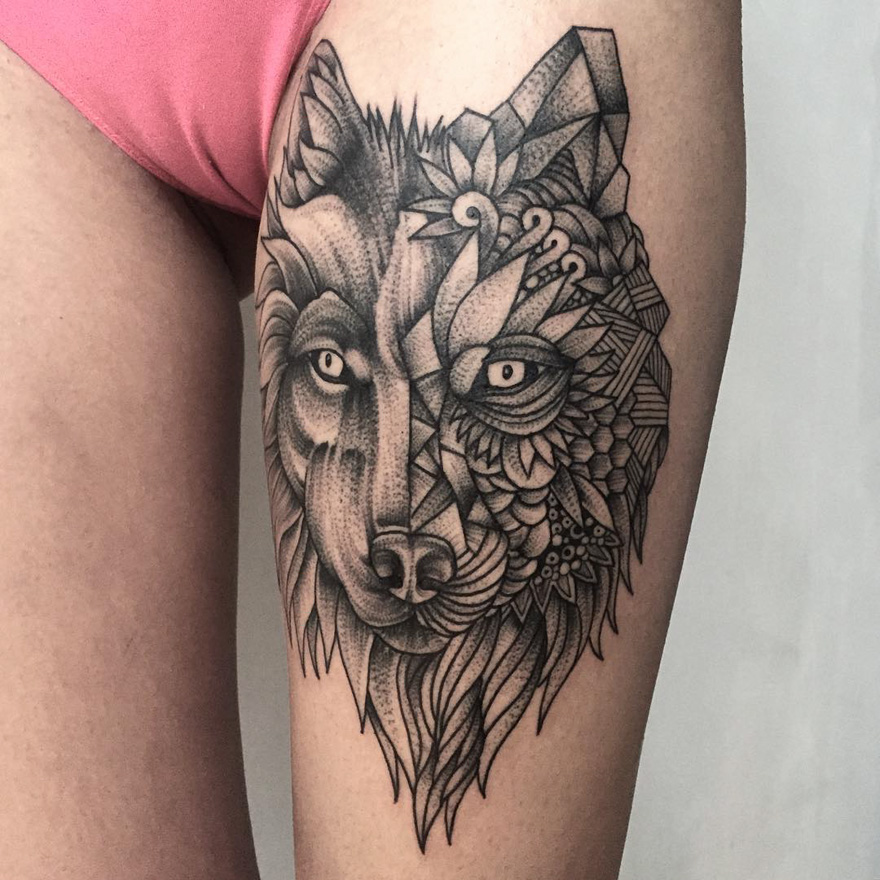 Geometric wolf tattoo on thigh, showcasing dark and eerie creature art by Russian artist.
