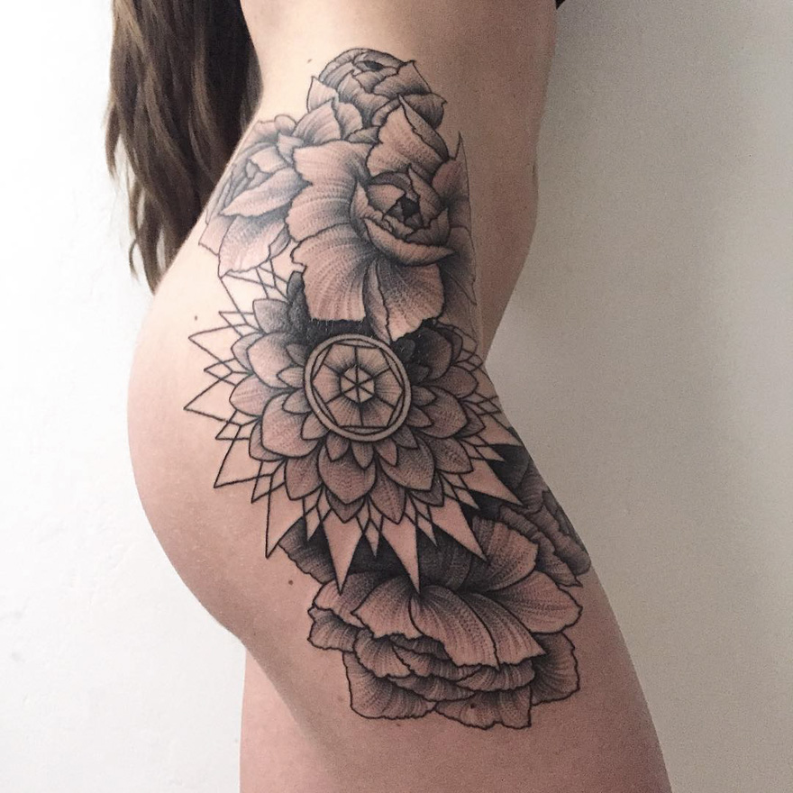 Tattoo of elaborate floral design on skin by Russian artist, showcasing intricate line work and shading.