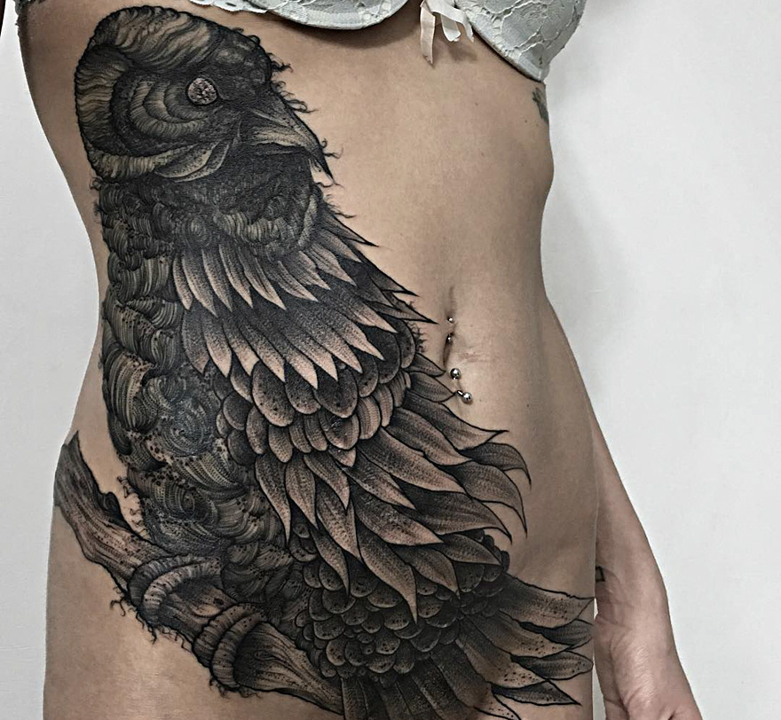Dark creature tattoo by Russian artist, featuring a detailed owl design on a person's torso.
