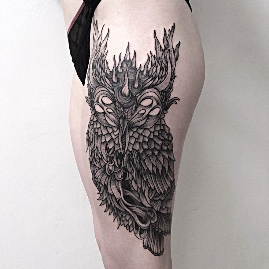 Dark and eerie creature tattoo of an owl on a thigh by Russian artist.