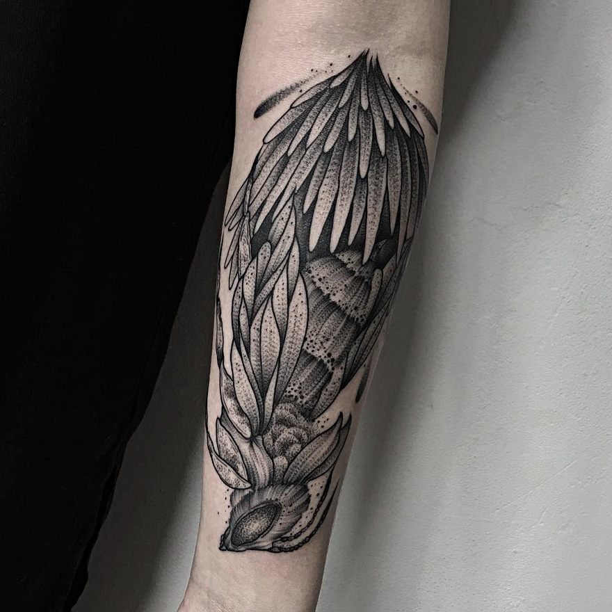Dark and eerie creature tattoo design on a forearm, showcasing intricate details by a Russian artist.