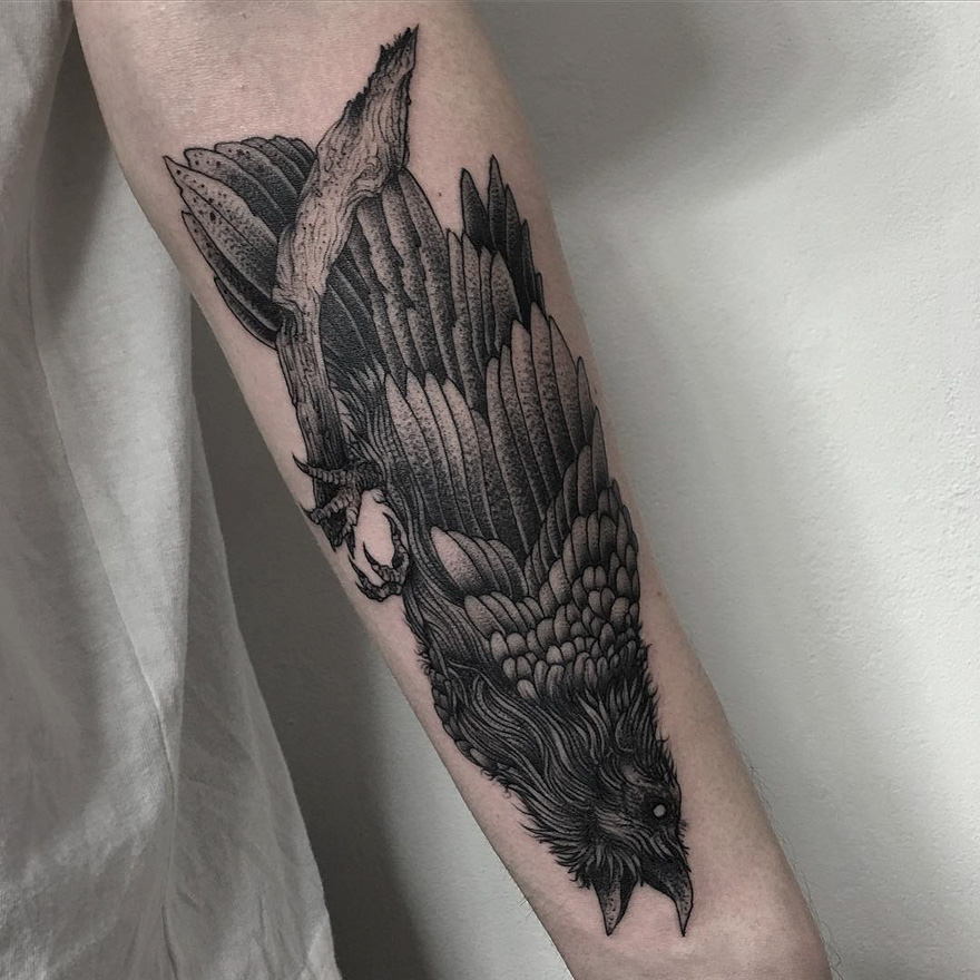 Tattoo of a dark and eerie creature on a person's arm by a Russian artist.