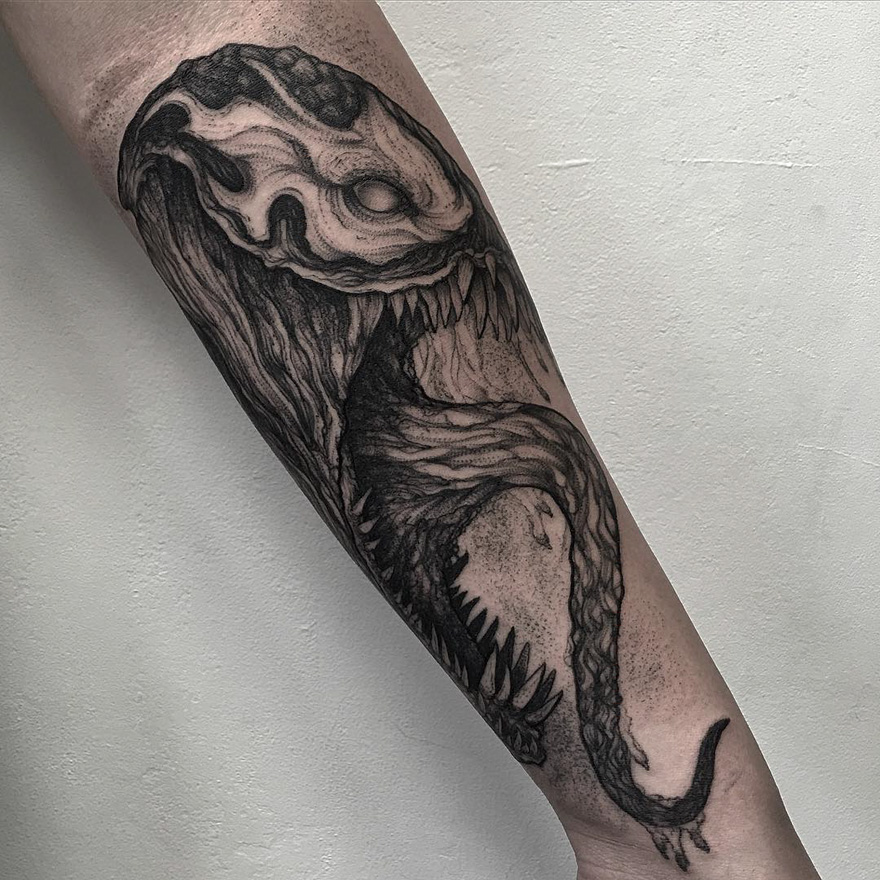 Tattoo of a dark, eerie creature on a forearm by Russian artist.