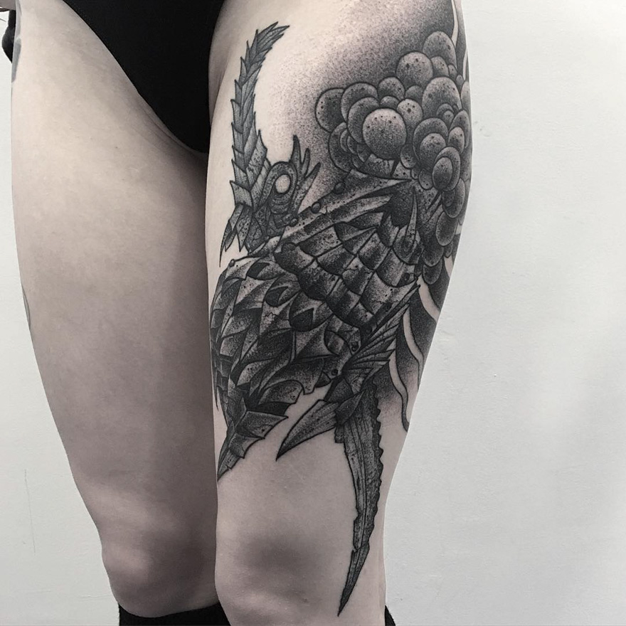 Thigh tattoo of a dark, eerie creature by a Russian artist, featuring intricate detailing and shading.