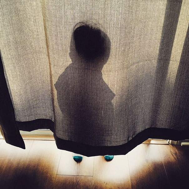 My Son Hiding. On The West Side Of Our House. At Sunset