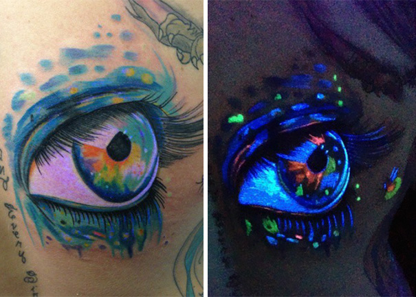 Glow in the dark tattoo of an eye, vibrant under black light illumination.