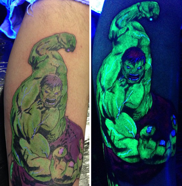 Glow in the dark tattoo of a superhero, visible under black light, showing vibrant green hues.