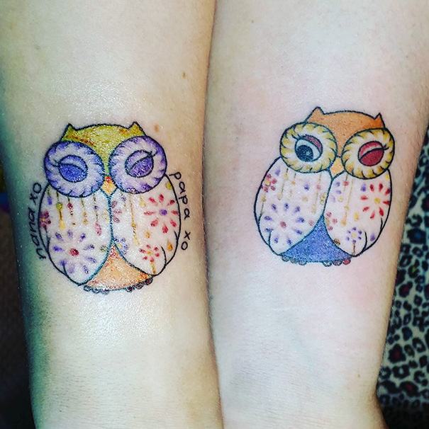 Colorful sister tattoos of owls on arms, symbolizing a strong bond.