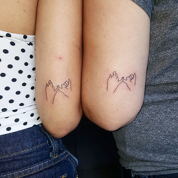 Minimalist tattoos of pinky promise designs on two arms, showcasing simple and inspiring ink art.