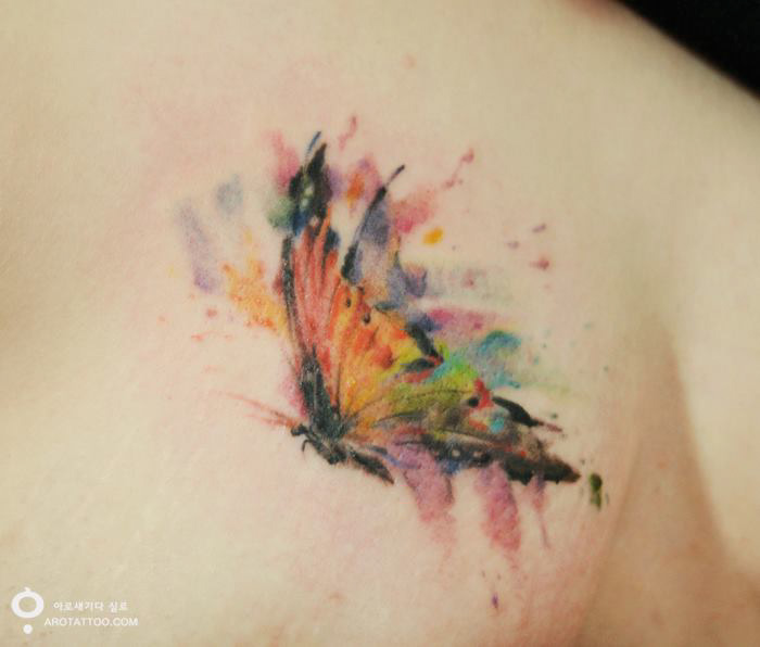 Watercolor-style flower tattoo on skin with vibrant colors and a soft, artistic appearance. Watercolor-style flower tattoo on skin with vibrant colors and a soft, artistic appearance.