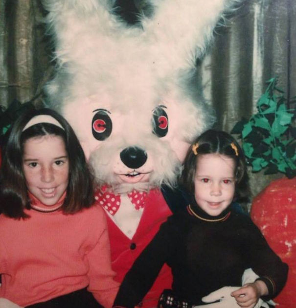 Vintage Easter bunny with two kids, wearing a red outfit and bow tie.